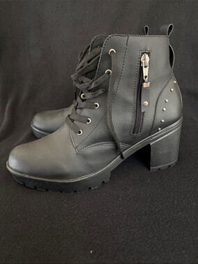 Black lace-up combat boots with block heels and side zippers